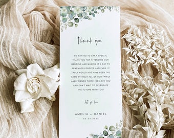May include: A thank you card with a watercolor floral design in shades of green and white. The card reads "Thank you" and includes the text "We wanted to say a special thank you for attending our wedding and making it a day to remember forever and ever. It truly would not have been the same without all of our family and friends there. We love you and can't wait to celebrate the future with you!" The card is signed "Amelia + Daniel" and includes the date "03.03.2023".