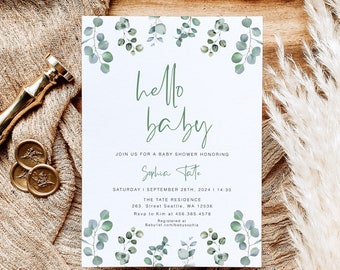 Könnte beinhalten: Eine weiße Babyparty-Einladung mit grünen Eukalyptusblättern am Rand. Der Text lautet "hello baby" in grüner Schreibschrift. Die Einladung enthält den Namen "Sophia Tate", das Datum "28. September 2024", die Uhrzeit "14:30", den Ort "The Tate Residence", die Adresse "263. Street Seattle, WA 12536", die RSVP-Informationen "Rsvp to Kim at 456.365.4578" und die Registrierungsinformationen "Registered at Babylist.com/babysophia".