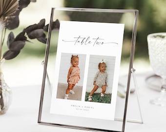 May include: Table number two sign with a white background and black text. The sign has two photos of children, one girl and one boy, with the text "Amelia + Daniel 03.03.2023" below the photos.
