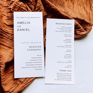 May include: Wedding ceremony programme with a white background and black text. The programme lists the order of events for the wedding ceremony of Amelia and Daniel on 3rd March 2023 in New Hope, PA. The programme also includes a list of the wedding party members.