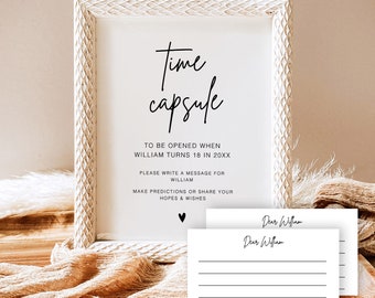 May include: White wooden frame with a sign that reads "Time Capsule" and instructions to write a message for William to be opened when he turns 18 in 20XX.  Two blank cards with the text "Dear William" are included.