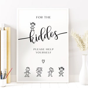 May include: A white sign with black text that reads "For the kiddos. Please help yourself." There are four stick figure drawings of children on the sign.