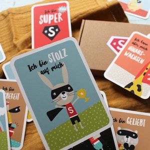 Mutmachkarten für Kinder | Affirmationskarten mit süßen Superhelden | 15 Stück, Coverkarte, A7, Box