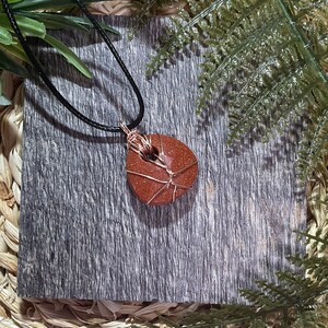 Wire wrapped goldstone pendant