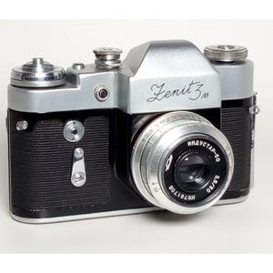 Vintage camera ZENIT 3M. Made in the USSR. It was produced from 1962 to 1970. The camera is faulty, only for collection and design work.