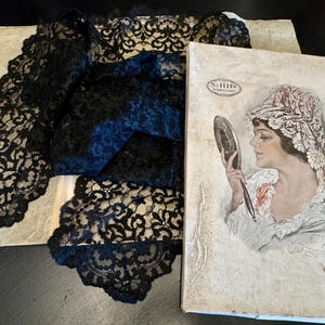 Antique Spanish mantilla. Catholic veil. Church scarf. Lace mantilla of the last century.