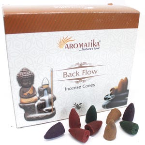 May include: Aromatik Back Flow Incense Cones box featuring a Buddha statue and waterfall incense burner. The box is brown and white with the Aromatik logo. Various coloured incense cones are in front of the box.