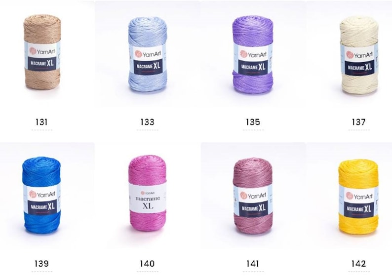 May include: Assortment of ten spools of macrame cord in various colors, including beige, light blue, purple, cream, blue, pink, mauve, and yellow. Each spool is labeled "YarnArt Macrame XL".