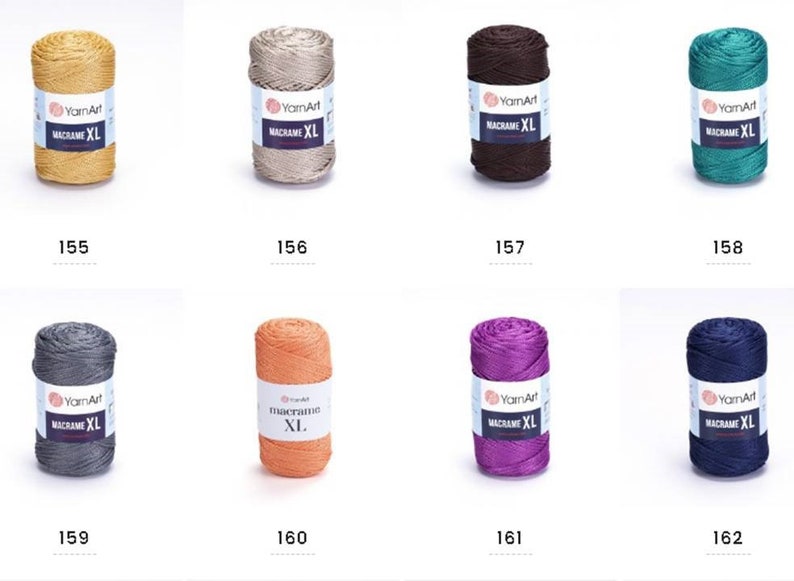 May include: Assortment of ten spools of macrame cord in various colors, including gold, beige, brown, teal, gray, orange, purple, and navy. Each spool is labeled "YarnArt Macrame XL".