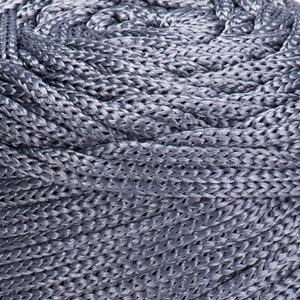 May include: Close-up of a coiled gray rope with a braided texture.