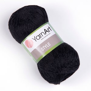 Pode incluir: Uma bola de l&atilde; preta com um r&oacute;tulo branco que diz "YarnArt" e "STYLE".