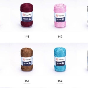 May include: Assortment of ten spools of macrame cord in various colors, including red, burgundy, pink, black, silver, brown, turquoise, and white. Each spool is labeled "YarnArt Macrame XL".