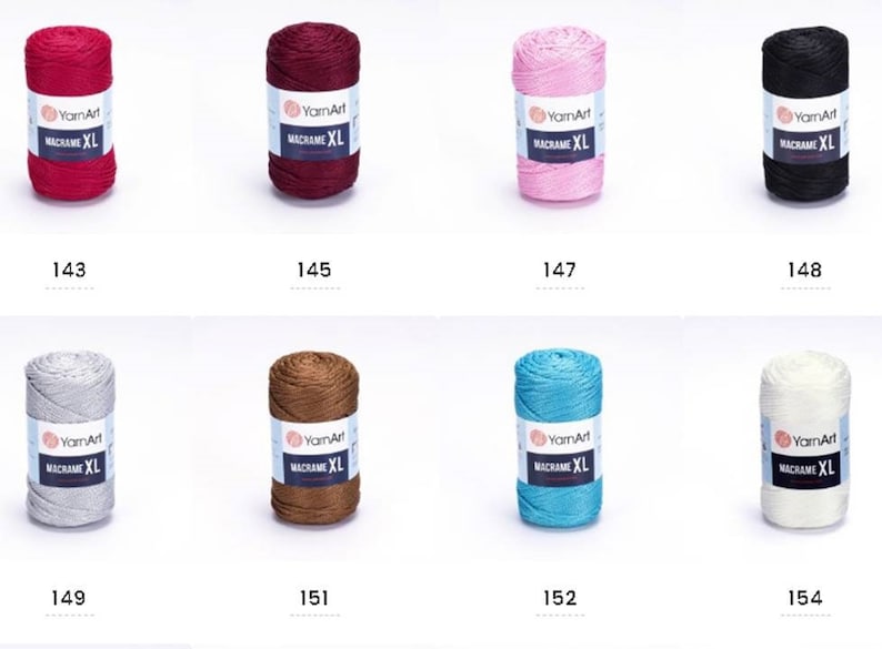 May include: Assortment of ten spools of macrame cord in various colors, including red, burgundy, pink, black, silver, brown, turquoise, and white. Each spool is labeled "YarnArt Macrame XL".
