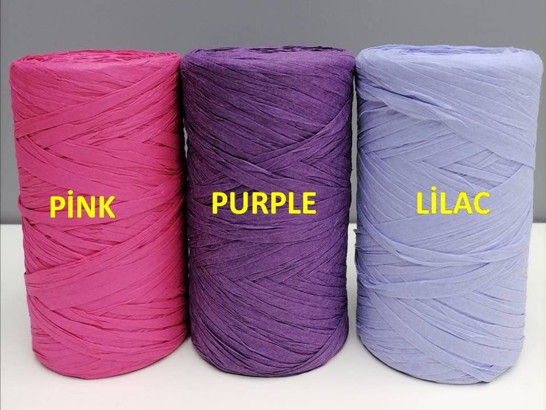 May include: Three spools of curling ribbon in pink, purple, and lilac. The spools are labeled "pink", "purple", and "lilac".