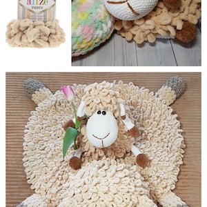 Puede incluir: Una alfombra de oveja tejida a crochet con una oveja tejida a crochet m&aacute;s peque&ntilde;a sentada encima. La alfombra es beige y las ovejas son blancas con detalles marrones. La lana utilizada es Alize Puffy.