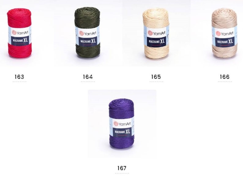 May include: Five spools of yarn in different colors: red, green, beige, light brown, and purple. Each spool has a label that says "YarnArt Macrame XL".