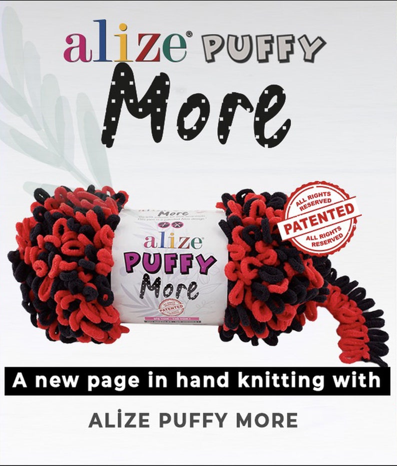 May include: A roll of black and red yarn labeled "alize PUFFY More" with a "PATENTED" stamp. The yarn is a fluffy, textured type.