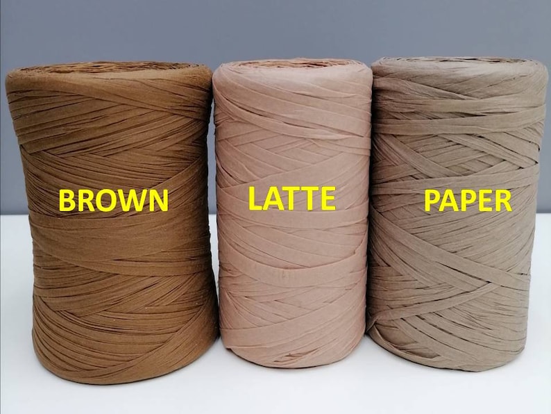 May include: Three spools of paper cord in brown, latte, and beige colors. The spools are labeled "BROWN", "LATTE", and "PAPER".