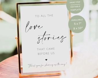 Könnte beinhalten: Ein goldgerahmtes Schild mit dem Text "TO ALL THE love stories THAT CAME BEFORE US." Das Schild enthält auch den Text "Thank you for showing us the way!" und ist in den Größen 12,7 x 17,8 cm und 20,3 x 25,4 cm erhältlich. Eine druckfertige, editierbare PDF-Vorlage.