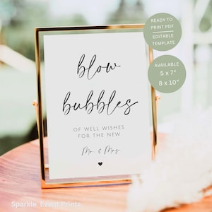 May include: A gold-framed sign with the words "blow bubbles" in elegant script. The sign includes the text "Of well wishes for the new Mr. & Mrs." and a small heart. Additional text indicates the sign is a ready-to-print, editable template, available in 5 x 7" and 8 x 10" sizes.