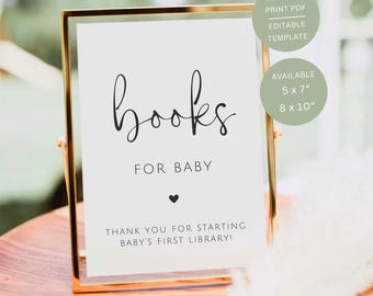 May include: A vertical rectangular sign in a thin gold frame featuring the black text books FOR BABY with a small heart icon and the phrase THANK YOU FOR STARTING BABY'S FIRST LIBRARY! The sign includes text indicating it is a 12.7 x 17.8 cm and 20.3 x 25.4 cm template.