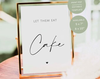 May include: A gold-framed sign featuring a white card with the black text LET THEM EAT Cake and a small heart icon. The sign includes text indicating it is a ready to print PDF editable template available in 5 x 7 and 8 x 10 inches.