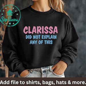 May include: Black sweatshirt with the text "CLARISSA DID NOT EXPLAIN ANY OF THIS" in pink and blue lettering.