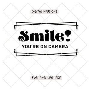 May include: Black and white graphic design with the text "Smile! You're on camera" in a retro font style. The text is framed by two black lines.