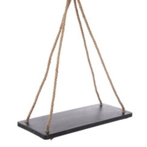 May include: A black wooden shelf hanging from a thick natural rope. The shelf is rectangular and has a rustic look.