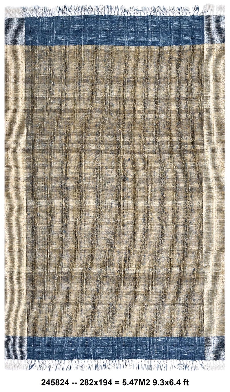 Handwoven area rug featuring geometric color blocks in rich navy blue, warm golden yellow, olive green and natural beige tones. This modern Turkish kilim style rug has a textured flat weave with white fringe edges, perfect for bohemian or Scandinavian interiors. Natural fiber construction creates an eco-friendly floor covering.