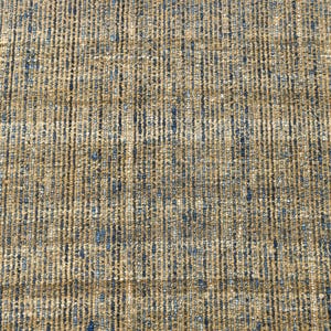 Handwoven area rug featuring geometric color blocks in rich navy blue, warm golden yellow, olive green and natural beige tones. This modern Turkish kilim style rug has a textured flat weave with white fringe edges, perfect for bohemian or Scandinavian interiors. Natural fiber construction creates an eco-friendly floor covering.