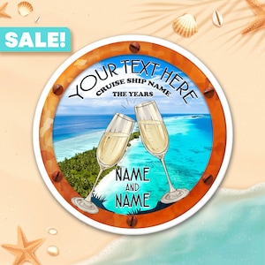 May include: A round orange and white porthole-style sign with the text "Your Text Here" and "Cruise Ship Name The Years" in a white circle. The sign has a picture of a tropical island with two champagne glasses clinking. The text "Name and Name" is below the glasses.