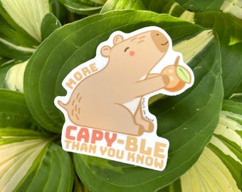 Pegatina de carpincho: Carpincho motivacional con naranja - Calcomanía para portátil o botella de agua