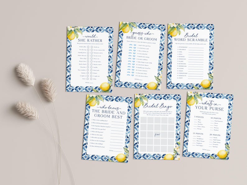May include: A set of six printable bridal shower game cards featuring a blue and white tile pattern with lemons. The games include "Would She Rather", "Guess Who: Bride or Groom", "Bridal Word Scramble", "Who Knows the Bride and Groom Best", "Bridal Bingo", and "What's in Your Purse".