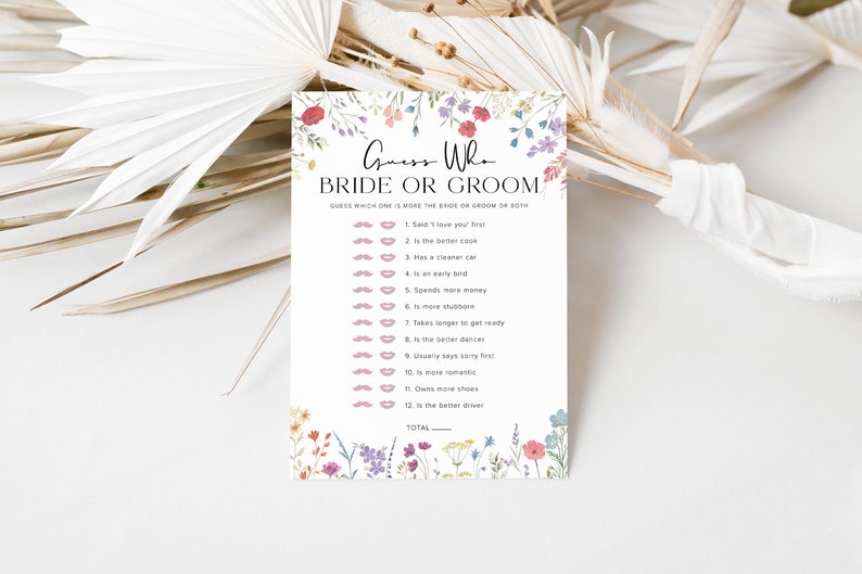 May include: A printable bridal shower game card with a floral border. The card has the title "Guess Who Bride or Groom" and a list of 12 questions to determine who is more likely to do something, the bride or the groom.