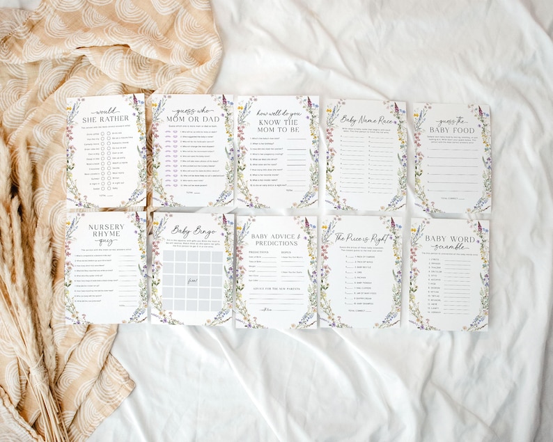 May include: A set of ten printable baby shower games with floral borders. The games include "Would She Rather", "Guess Who Mom or Dad", "How Well Do You Know the Mom to Be", "Baby Name Race", "Guess the Baby Food", "Nursery Rhyme Quiz", "Baby Bingo", "Baby Advice Predictions", "The Price is Right", and "Baby Word Scramble".