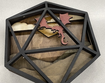 May include: A wooden, black-framed, three-dimensional, geometric, icosahedron-shaped wall art piece with a red dragon flying through a layered landscape scene.