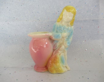 Vintage planter bud vase, young man with feathery plume hat, pastel pink yellow blue