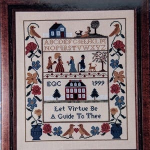 May include: A framed cross-stitch sampler with the text "Let Virtue Be A Guide To Thee." The sampler features a house, birds, flowers, and figures. The background is a blue floral pattern, and the frame is brown.