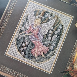 Lily Maiden autorstwa Teresy Wentzler, wzór do haftu krzyżykowego, ulotka Vintage 1995