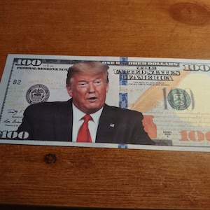 Donald Trump Novelty 100 Dollar Bill. (not real) Sleeved. Free Ship.