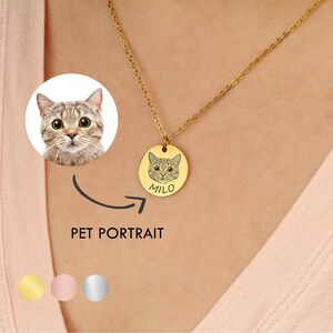 May include: Gold necklace with a round pendant featuring a personalised pet portrait of a cat with the name "Milo" engraved below. The necklace is shown on a person's chest. Three colour options are shown below the image: gold, rose gold, and silver.