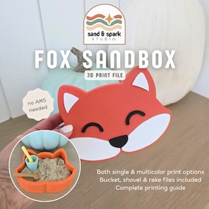 May include: A 3D printed fox-shaped sandbox container in orange, white, and black. The set includes a small bucket, shovel, and rake. Text on the image reads: sand & spark studio, FOX SANDBOX, 3D PRINT FILE, no AMS needed, and details about print options.