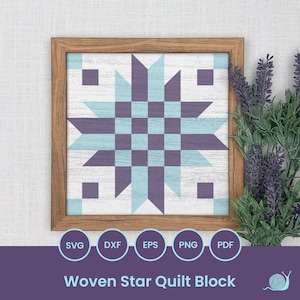 May include: A framed quilt block with a woven star design in shades of purple and blue. The block is set against a white background and has a wood frame.