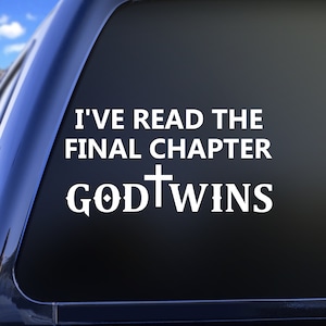 May include: White vinyl decal with the text "I'VE READ THE FINAL CHAPTER GOD WINS" in a bold, sans-serif font. The word "GOD" features a cross replacing the letter "O". The decal is designed for application on a vehicle window.