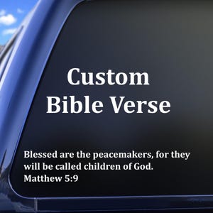 May include: A custom Bible verse decal in white lettering on a dark background. The text reads "Custom Bible Verse" above the verse "Blessed are the peacemakers, for they will be called children of God. Matthew 5:9."
