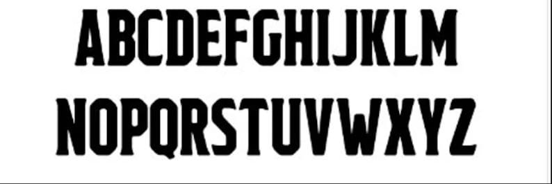May include: Black and white alphabet letters in a bold, blocky font style. The letters are arranged in two rows, with the letters A through M in the top row and N through Z in the bottom row.