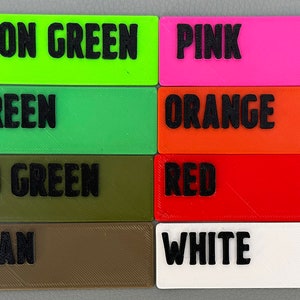 May include: A color chart with 16 different color swatches. The colors are: dark blue, neon green, pink, purple, light blue, green, orange, grey, teal, OD green, red, black, yellow, tan, and white.