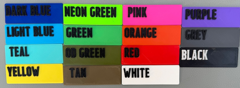 May include: A color chart with 16 different color swatches. The colors are: dark blue, neon green, pink, purple, light blue, green, orange, grey, teal, OD green, red, black, yellow, tan, and white.