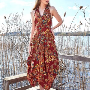 Floral pattern summer dress with halter back style. It V-Neck with coconut buttons, and it looks so stylish. Bohemian style floral pattern dress